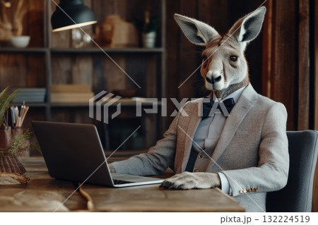 Confident Humanoid Kangaroo in a Crisp Gray Suit Working on a Laptop in an Office Setting 132224519