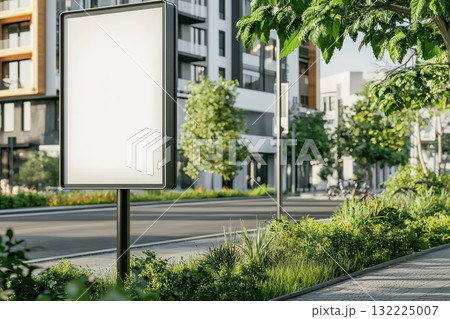 Urban landscape featuring blank billboard near modern residential buildings with lush greenery and pedestrian pathway in a sunny environment Urban landscape featuring blank billboard near modern residential buildings with lush greenery and pedestrian pathway in a sunny environment 132225007