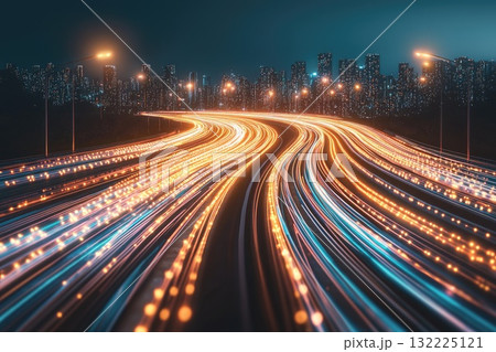 A city street with a long, curving road with many lights on it 132225121