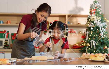Family Baking: Mother and Daughter Creating Holiday Treats Together 132225488