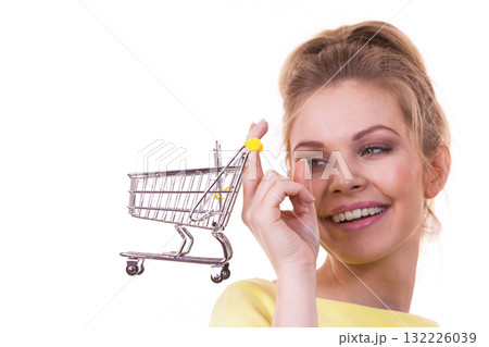 Woman holding shopping cart Woman holding shopping cart 132226039