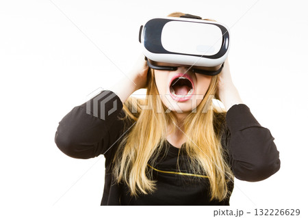 Woman wearing VR goggles Woman wearing VR goggles 132226629