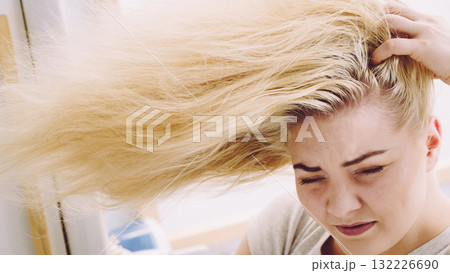 Female having problem with blonde hair Female having problem with blonde hair 132226690