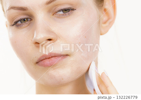 Girl removes mask cosmetic Girl removes mask cosmetic 132226779
