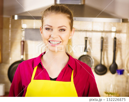 Young woman wearing apron Young woman wearing apron 132226875