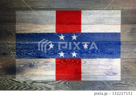 Netherlands Antilles flag on rustic old wood surface background 132227151