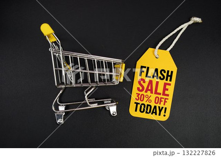 Mini Trolley Shopping Cart and price tag with message "Flash Sale 30% Off Today!" on black background Mini Trolley Shopping Cart and price tag with message "Flash Sale 30% Off Today!" on black background 132227826