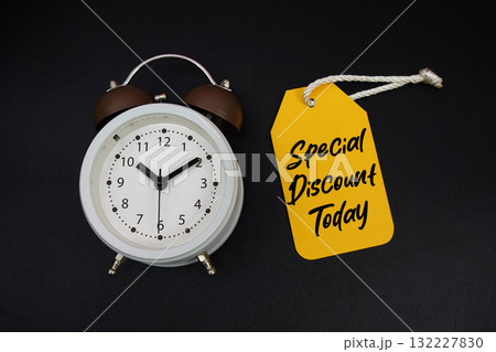 Price tag with message "Special Discount Today" and alarm clock on black background Price tag with message "Special Discount Today" and alarm clock on black background 132227830