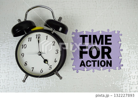 Time For Action text with alarm clock on purple background Time For Action text with alarm clock on purple background 132227893