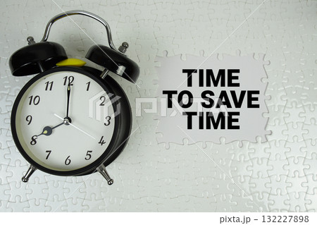 Time To Save Time text with alarm clock on white background Time To Save Time text with alarm clock on white background 132227898