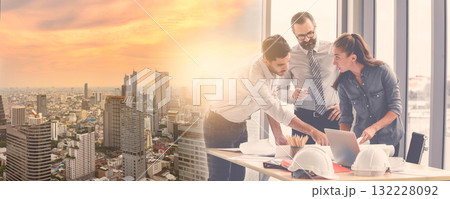 Double exposure image of Engineers team meeting for architectural project during overlay with construction site in the city. Double exposure image of Engineers team meeting for architectural project during overlay with construction site in the city. 132228092