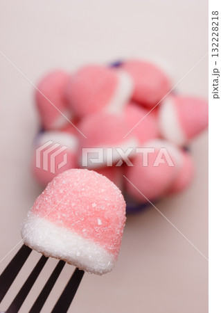 Pink gummy sweets with sugar, top view 132228218