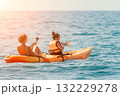 Two Young Women Kayaking and Taking Pictures on a Bright Sunny Day 132229278