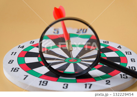 Dart board game with magnifying, Leader concept. Dart board game with magnifying, Leader concept. 132229454