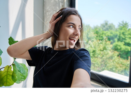 Close-up selfie portrait of smiling teenage female Close-up selfie portrait of smiling teenage female 132230275