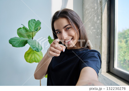 Close-up selfie portrait of teenage female looking at web camera Close-up selfie portrait of teenage female looking at web camera 132230276