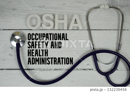 OSHA Occupational Safety and Health Administration text with Stethoscope on wooden background OSHA Occupational Safety and Health Administration text with Stethoscope on wooden background 132230456