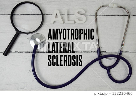 ALS Amyotrophic Lateral Sclerosis text with Stethoscope on wooden background 132230466