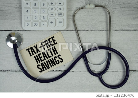 Tax-Free Health Savings text with Stethoscope and calculator on wooden background Tax-Free Health Savings text with Stethoscope and calculator on wooden background 132230476