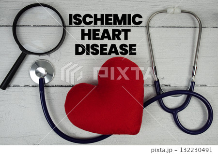 Ischemic Heart Disease text with Red heart, Magnifying glass and Medical Stethoscope on wooden background 132230491