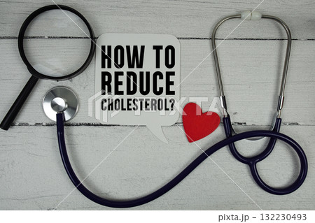 How To Reduce Cholesterol text with Red heart, Magnifying glass and Medical Stethoscope on wooden backgroundol How To Reduce Cholesterol text with Red heart, Magnifying glass and Medical Stethoscope on wooden backgroundol 132230493