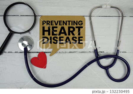 Preventing Heart Disease text with Red heart, Magnifying glass and Medical Stethoscope on wooden background Preventing Heart Disease text with Red heart, Magnifying glass and Medical Stethoscope on wooden background 132230495