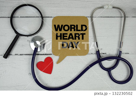 World Heart Day text with Red heart, Magnifying glass and Medical Stethoscope on wooden background World Heart Day text with Red heart, Magnifying glass and Medical Stethoscope on wooden background 132230502
