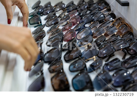 Choosing Sunglasses from a Display Choosing Sunglasses from a Display 132230719