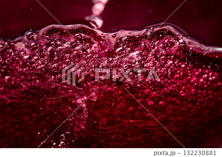 Macro shot of red wine in motion. 132230881
