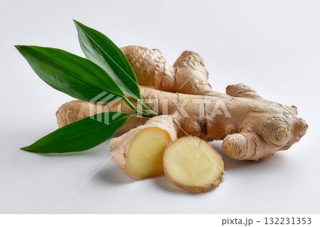 Fresh Ginger Root With Green Leaves on a Bright Background 132231353