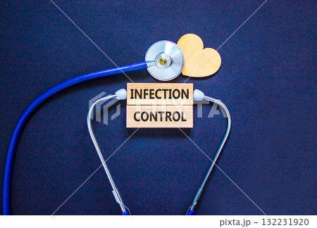 Infection control symbol. Concept words Infection control on beautiful wooden blocks. Wooden heart and stethoscope. Beautiful black background. Medical healthy lifestyle infection control concept. 132231920