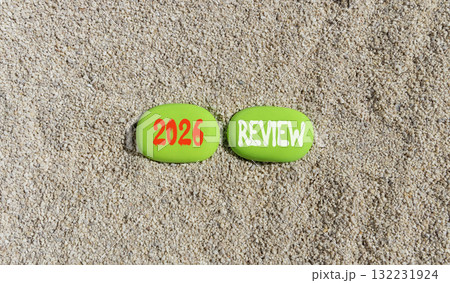 2026 Review symbol. Concept words 2026 Review on beautiful green stones on sand beach. Beautiful sand beach background. Business and 2026 review concept. Copy space. 2026 Review symbol. Concept words 2026 Review on beautiful green stones on sand beach. Beautiful sand beach background. Business and 2026 review concept. Copy space. 132231924