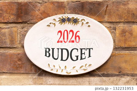 2026 Budget symbol. Concept words 2026 Budget on beautiful white sign. Beautiful old brown brick wall background. Business and 2026 budget concept. Copy space. 132231953
