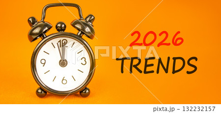 2026 Trends new year symbol. Concept words 2026 Trends on beautiful orange paper. Beautiful orange paper background. Beautiful black alarm clock. Business and 2026 Trends new year concept. Copy space. 132232157