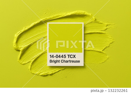 Bright chartreuse color sample with paint stroke background 132232261