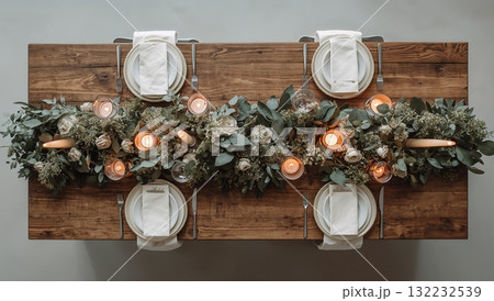 A table with four white plates and four forks 132232539