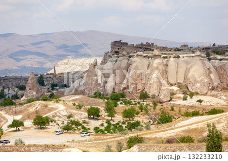 Volcanic rock formations landscape in Cappadocia, place of residence of ancient Christians Volcanic rock formations landscape in Cappadocia, place of residence of ancient Christians 132233210