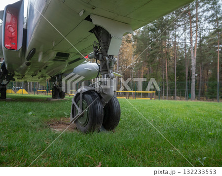 aircraft gear closeup, rustic museum exhibit showcasing detailed aircraft landing gear setup, detailed closeup view of airplane landing gear components with museum setting and accessories 132233553
