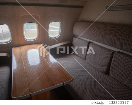 cozy wooden dining, comfortable area with plush seating, intimate dining space featuring plush chairs and wooden table, warm and inviting wooden dining zone with cushioned chairs 132233557