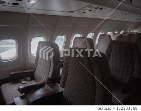premium cabin ready for travel, elegant aircraft interior designed for comfort, sophisticated airplane cabin featuring peaceful ambiance suitable for private journeys and preflight premium cabin ready for travel, elegant aircraft interior designed for comfort, sophisticated airplane cabin featuring peaceful ambiance suitable for private journeys and preflight 132233569