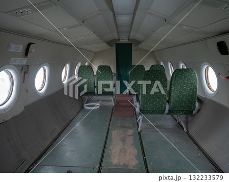 aircraft seats inventory, green aircraft seats for salvage, decommissioned and cataloged aircraft seating inventory, scattered green airplane seats used for salvage and photographic 132233579