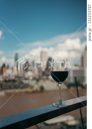 red wine on terrace with Bangkok city skyline at sunset, cocktail on rooftop, vibrant cityscape and luxury panorama view red wine on terrace with Bangkok city skyline at sunset, cocktail on rooftop, vibrant cityscape and luxury panorama view 132233787
