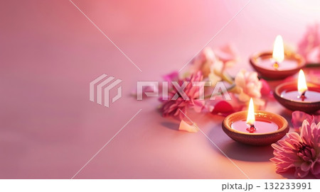 Diya oil lamps pots, surrounded by pink flowers. A candles and flowers with a warm and inviting Diwali mood. Copy place Diya oil lamps pots, surrounded by pink flowers. A candles and flowers with a warm and inviting Diwali mood. Copy place 132233991
