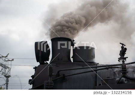 Thick smoke rises from the chimney of a historic black steam locomotive at the Moscow Railway Museum Turntable 132234156