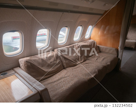 luxurious private jet interior, elegant cabin with adaptable seating and ambient lighting, private jet interior featuring flexible seating options and soothing ambient lighting luxurious private jet interior, elegant cabin with adaptable seating and ambient lighting, private jet interior featuring flexible seating options and soothing ambient lighting 132234502