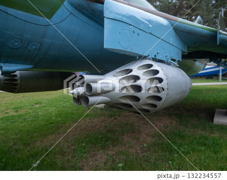 nozzle end of rocket pod revealing bore, perforation pattern and surface wear, soot traces and manufacturing marks visible, macro perspective ideal for materials and restoration analysis 132234557