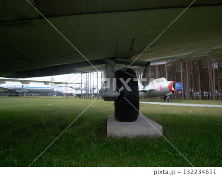 vintage airplane wheel and environment, details of old airplane wheels and their surroundings, historical aircraft wheel specifications along with surrounding components and context 132234611