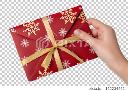 Hand holding festive red envelope with gold foil snowflake designs, isolated on transparent background for christmas or chinese new year celebrations Hand holding festive red envelope with gold foil snowflake designs, isolated on transparent background for christmas or chinese new year celebrations 132234662