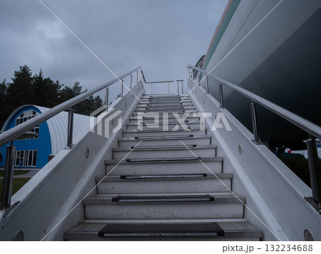 calm morning at airport with trees and stairs, serene morning scene at airport with greenery and stairs, tranquil early morning atmosphere at airport featuring stairs and lush green calm morning at airport with trees and stairs, serene morning scene at airport with greenery and stairs, tranquil early morning atmosphere at airport featuring stairs and lush green 132234688