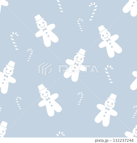 Seamless Christmas pattern with gingerbread men and candy canes on blue background 132237248